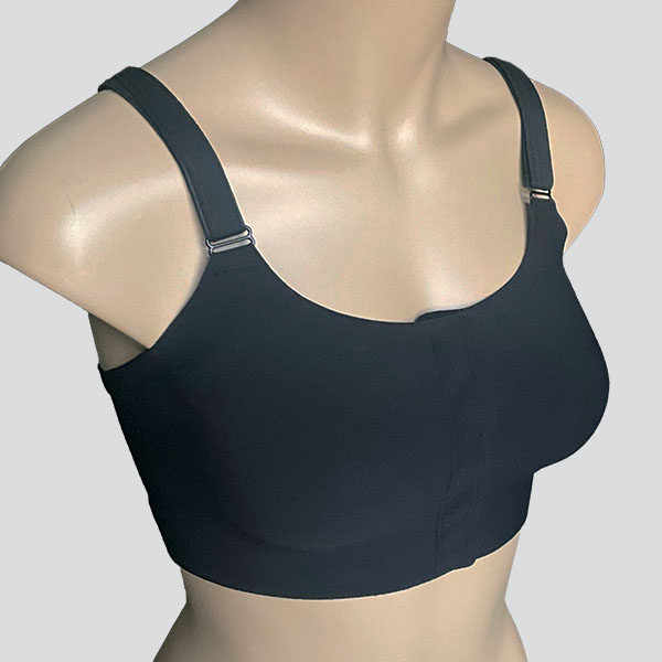 Side perspective of the Amoena Jackie front fastening padded wireless bra showing curved neckline and round breast shape.